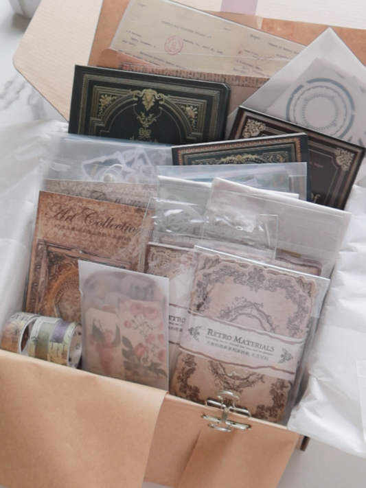Collection of vintage-style stationery items in a box